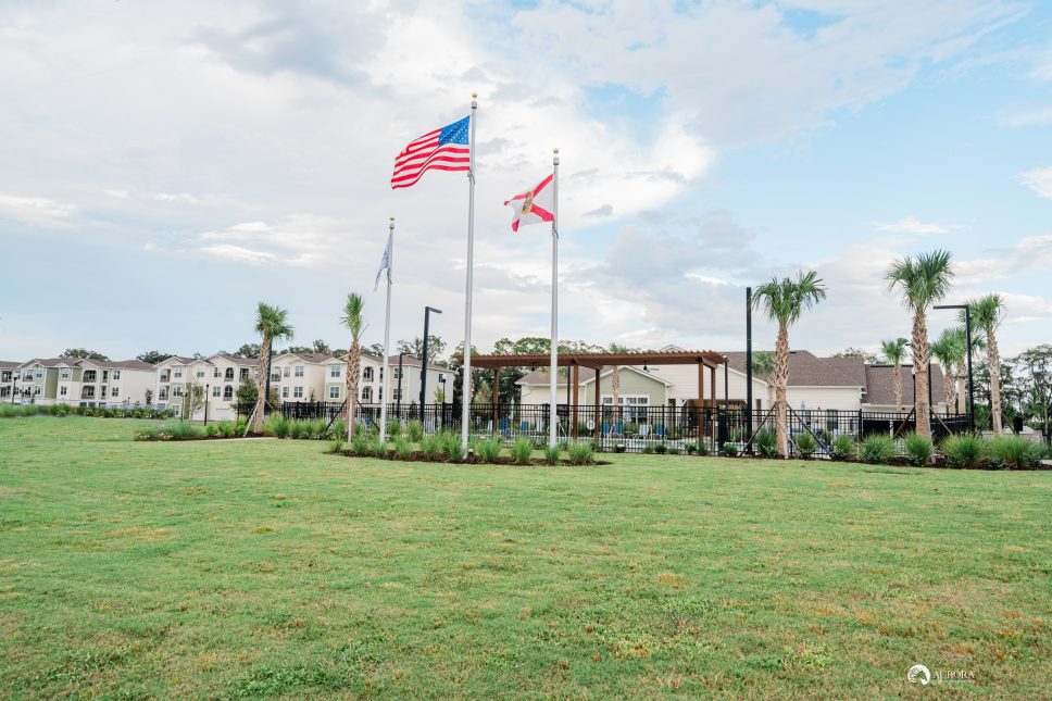 A 42 Apartment Property Management's grassy area in front of a building.