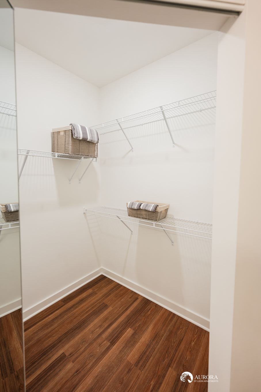 A walk in closet with 42 shelves and baskets.