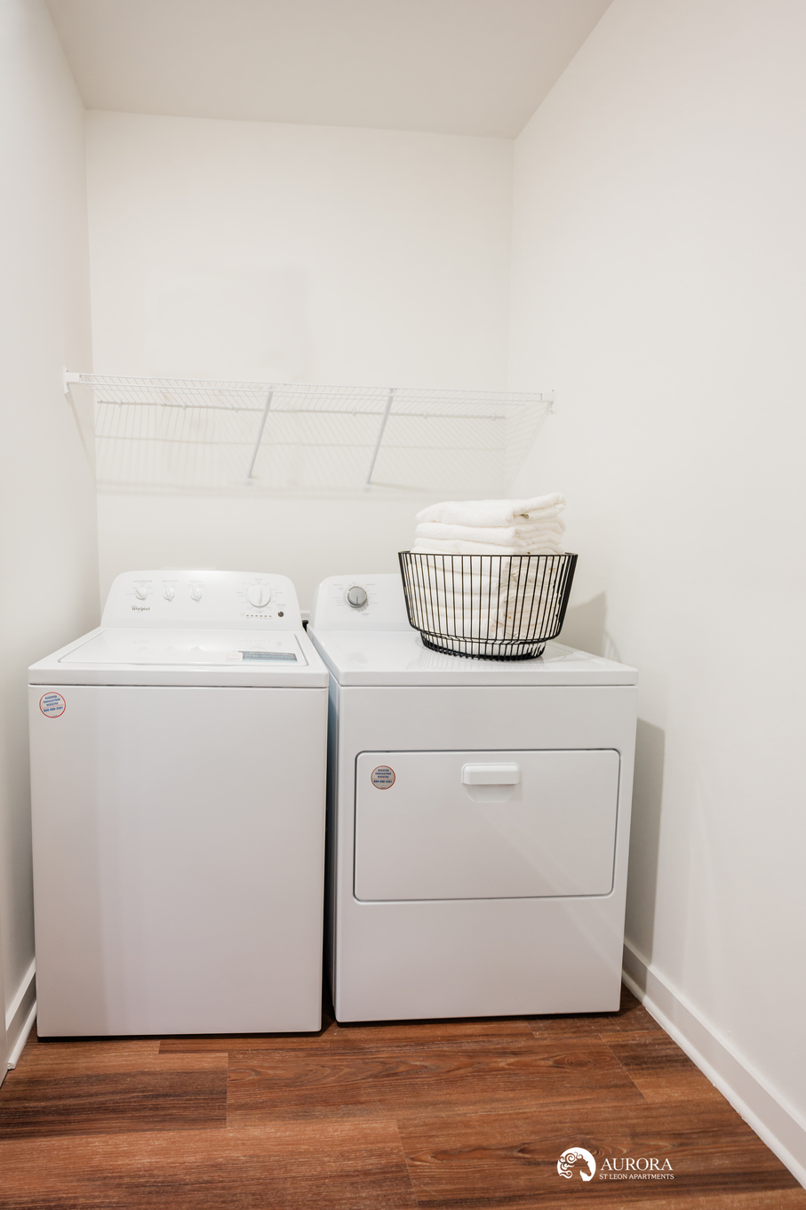 Two washers and dryers in a small room for 42 Apartment Property Management.